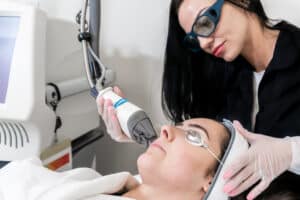 Woman relaxes during a laser skin treatment in GA